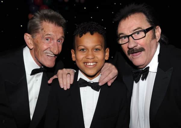 Sports achievement winner Junior Frood with Chuckle Brothers Barry and Paul at the Yorkshire Children of Courage Awards.