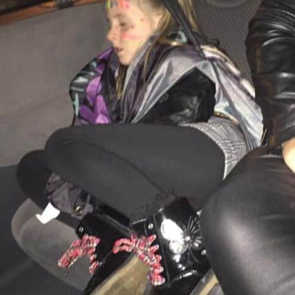 Lacey Yorston asleep at the One Direction concert.