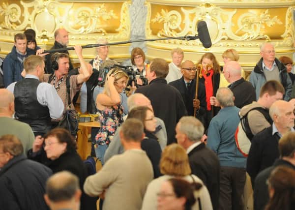 Date:28th October 2015. Picture James Hardisty, (JH1011/06j) Antiques Road Show at the Royal Hall, Harrogate.Pictured Antiques Road Show Miscellaneous expert Ronnie Archer-Morgan, (Centre with Glasses) holding of walking stick during filming.