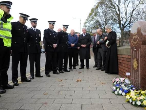 Police at memorial to Sgt Speed on Kirkgate