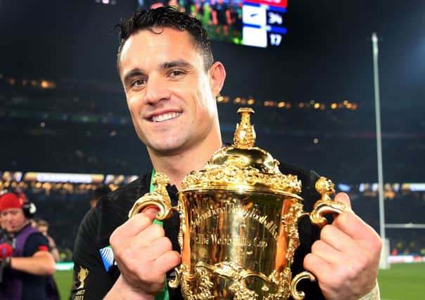 File photo dated 01/11/15 of New Zealand's Dan Carter with the Webb Ellis Cup during the Rugby World Cup Final at Twickenham, London, as broadcaster ITV said the Rugby World Cup and popular live episodes of Coronation Street and Emmerdale helped improve under-pressure audience figures. PRESS ASSOCIATION Photo. Issue date: Tuesday November 10, 2015. The group, which is home to shows including Downton Abbey and The X Factor, said it narrowed falls in its share of Britain's television audience over the past few months. See PA story CITY ITV. Photo credit should read: David Davies/PA Wire