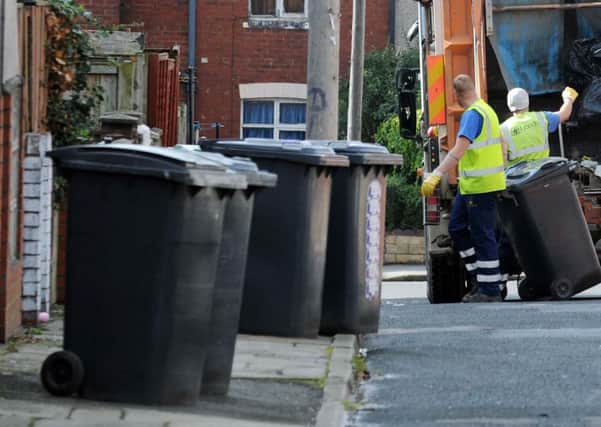 Bins being emptied in Leeds.