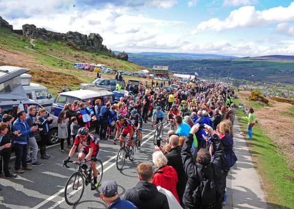 The peloton of the Tour de Yorkshire make their way through the crowds on the Cow and Calf in Ilkley last year. Picture by Tony Johnson