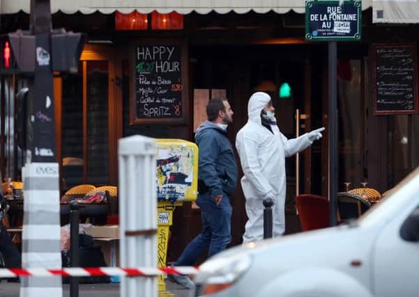 Police and forensic activity outside the La Casa Nostra pizzeria, in rue de la Fontaine au Roi, Paris one of the venues for the attacks in the French capital. PIC: PA