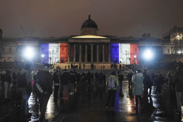 The National Gallery, in London, illuminated with the colours of the French tricolor as London stands in solidarity with its sister European capital
