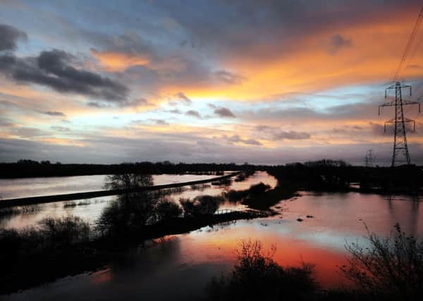 Rapidly-changing weather: Floodwater still covers fields around York after the River Ouse rose following days of torrential rain.