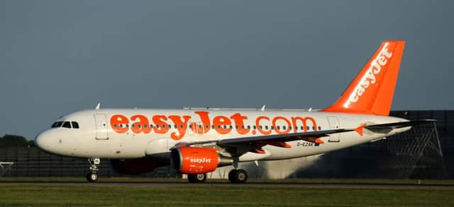 File photo dated 15/06/15 of an easyJet passenger plane at Stansted Airport in Essex, as the airline said the Paris terror attacks will have a minimal impact on the budget airline as "resilient" passengers will still want to travel. PRESS ASSOCIATION Photo. Issue date: Tuesday November 17, 2015. Shares in easyJet, which focuses mainly on the western and northern European markets, dipped almost 4% on Monday morning as investors expressed concerns over the impact of the terror attacks on both the travel and leisure sectors. See PA story CITY EasyJet. Photo credit should read: Chris Radburn/PA Wire