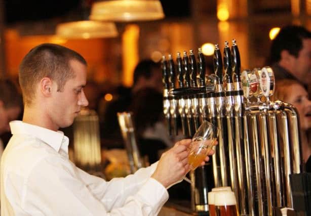 Undated handout photo issued by Mitchells & Butlers of a waiter pouring a drink at an All Bar One,  whose owner signalled it may have to hike prices as it faces soaring staff costs from the national living wage. PRESS ASSOCIATION Photo. Issue date: Tuesday November 24, 2015. Mitchells & Butlers, which employs more than 44,000 workers across nationwide chains including Toby Carvery and O'Neill's, said it would look at ways to increase customer spend, including "tactical price opportunities" across some of its pubs and restaurants. See PA story CITY Mitchells. Photo credit should read: Mitchells & Butlers/PA WireNOTE TO EDITORS: This handout photo may only be used in for editorial reporting purposes for the contemporaneous illustration of events, things or the people in the image or facts mentioned in the caption. Reuse of the picture may require further permission from the copyright holder.