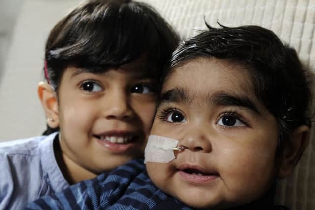 Dawud Raza, one,  and his sister Khadijah, three.