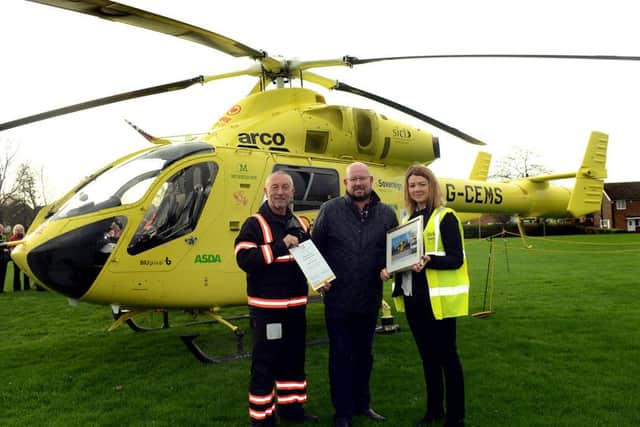 Mark Larkin is presented with an award by Andy Hall, YAA pilot, and Kerry Garner.