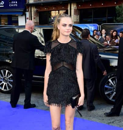 Cara Delevingne in a little black fringed and sequin number.

attending the world premiere of Pan, held at the Odeon, Leicester Square, London. Ian West/PA Wire