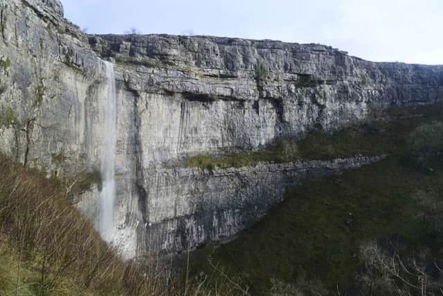 Water falls over the cliffs at Malham Cove, North Yorkshire, for the first time in a hundred years  following heavy rain in the area. Picture: Jim Sputnik/PA Wire