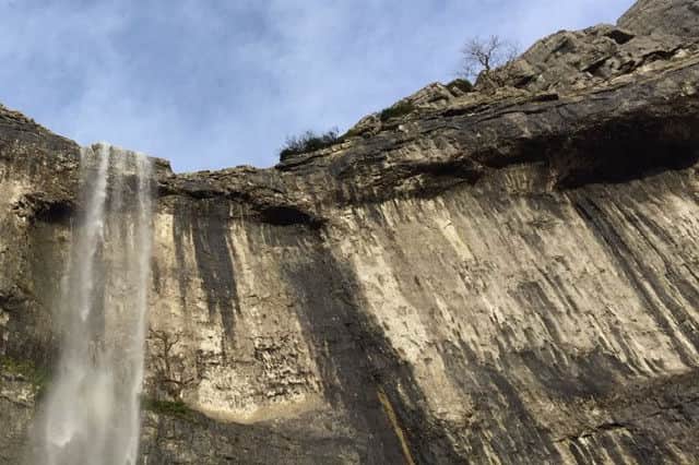Water falls over the cliffs at Malham Cove, North Yorkshire, for the first time in a hundred years  following heavy rain in the area. Picture: Alan Hulme/PA Wire