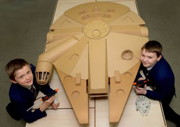 Ethan Newman, 12, and Jake Ellis, 13, pupils at Fulneck School, with their Millennium Falcon made from recycled materials. Picture by Gary Longbottom.