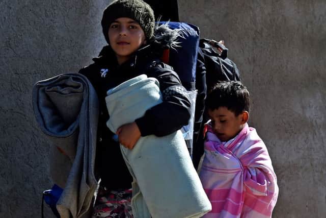 Syrian refugee children heading for a refugee centre in Presevo, Serbia. Photo: Owen Humphreys/PA Wire