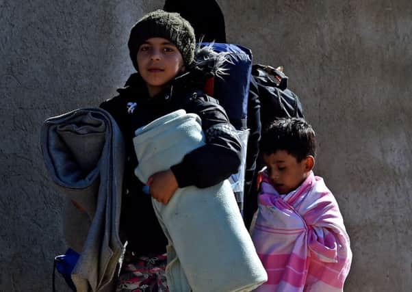 Syrian refugee children heading for a refugee centre in Presevo, Serbia.  Photo: Owen Humphreys/PA Wire