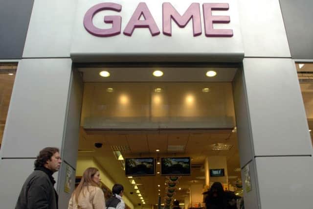 Shoppers passing a Game store. Photo credit: Johnny Green/PA Wire