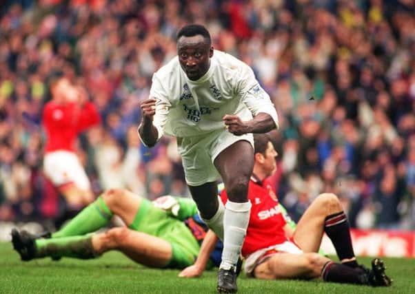 Tony Yeboah leaves Manchester United's Peter Schmeichel and Dennis Irwin grounded as he celebrates his goal, Leeds's second of the match on Christmas Eve, 1995.