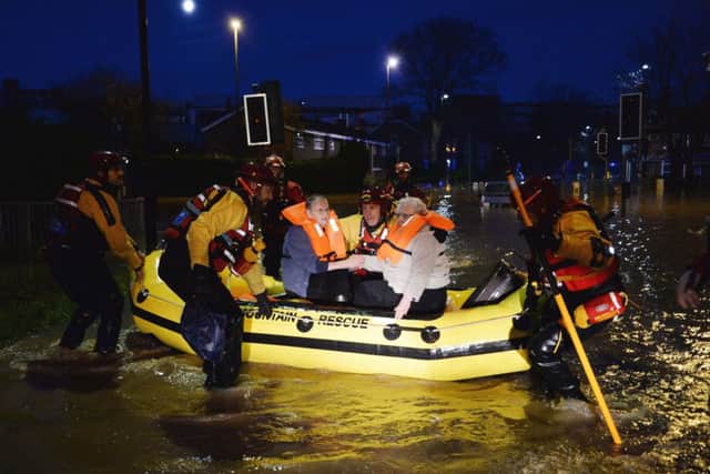 Residents in York are evacuated by members of a Mountain Rescue team after the River Foss bursts its banks