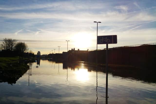 Sunrise over floodwater in Kirkstall Road, Leeds. Picture: David Wheatley