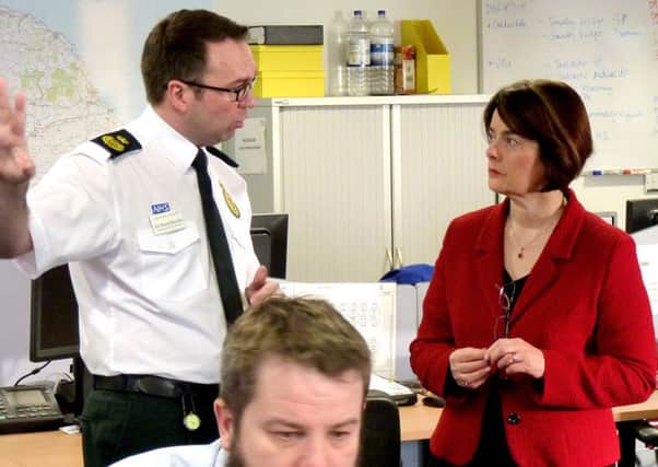 Dr David Macklin with Minister for Public Health, Jane Ellison, at Yorkshire Ambulance Service NHS Trust Headquarters in Wakefield.