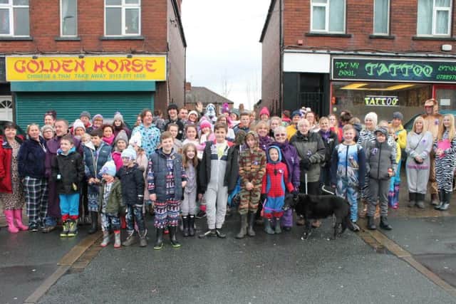 Dozens of supporters gather for the start of the onesie walk in aid of Val Duggan.