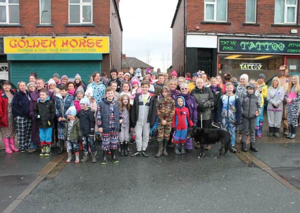 Dozens of supporters gather for the start of the onesie walk in aid of Val Duggan.