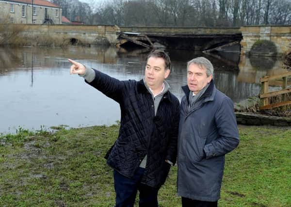 Robert Goodwill MP visited Tadcaster yesterday and was shown damage to the bridge by Nigel Adams MP.
