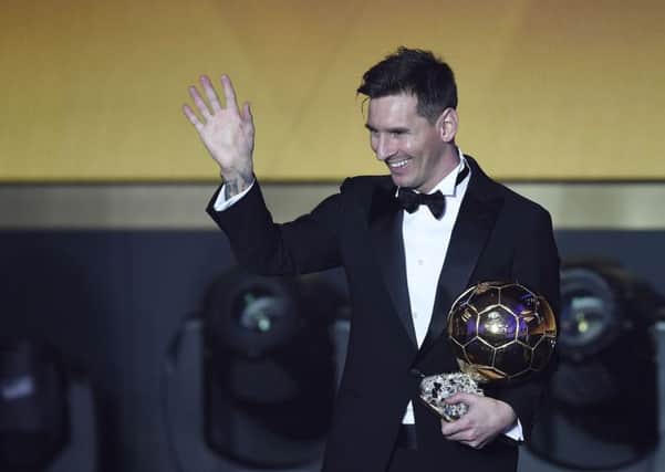 Lionel Messi poses with his trophy after winning the FIFA Men's soccer player of the year 2015 prize during the FIFA Ballon d'Or awarding ceremony at the Kongresshaus in Zurich, Switzerland.
