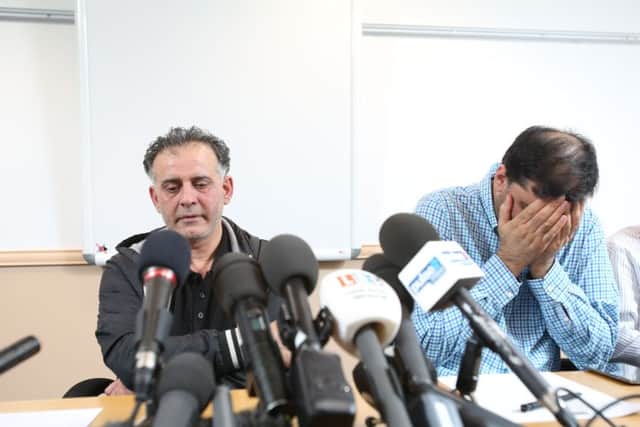 Picture shows Ahktar Iqbal (left) and Mohammed Shoaib (right), husbands of two of the missing women who are suspected to have fled to Syria along with their children, reading statements to the media at the Bradford Hotel in Bradford, West Yorkshire. Three sisters of the Dawood family are feared to have fled to Syria along with their nine children. They were last known to have boarded a flight to Istanbul on the 9th June.
Ian Hinchliffe / Rossparry.co.uk