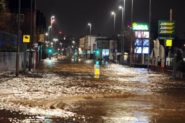 DECEMBER 2015: Floodwater on Kirkstall Road. PIC: Tony Johnson