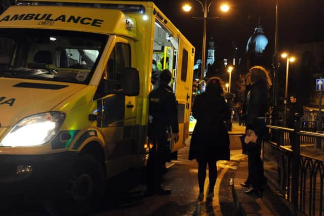 Ambulance crews attend to an injury on the streets of Leeds. Library picture.