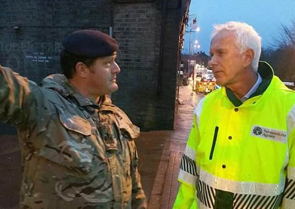 Sir Philip Dilley eventually visited flood-hit West Yorkshire after flying back to the UK from his 'home' in Barbados. Photo: Environment Agency.