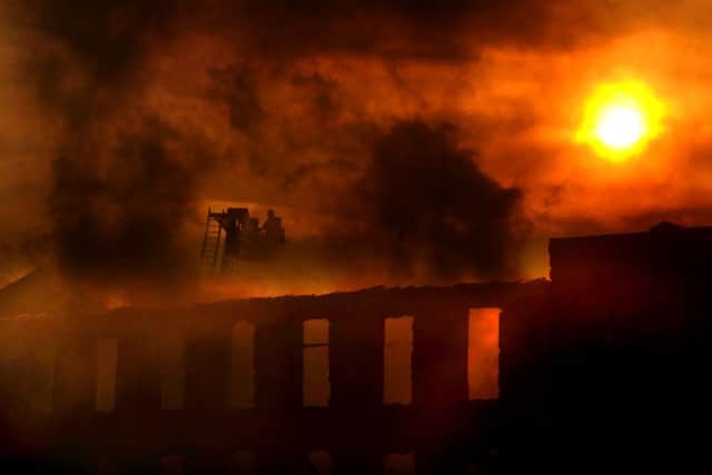 Firefighters put out the blaze at the mill in Grange Road, Batley. Picture by Simon Hulme