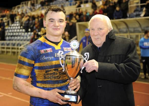 Jordan Lilley receives the Lazenby Cup from Harry Jepson.