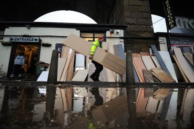 Volunteers clear out Bridge Craft Interiors, Kirkstall Road.