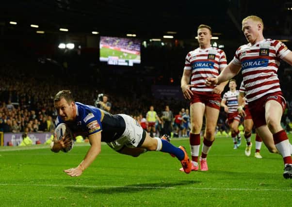 Danny McGuire dives over to score his side's third try during the First Utility Super League Grand Final at Old Trafford.