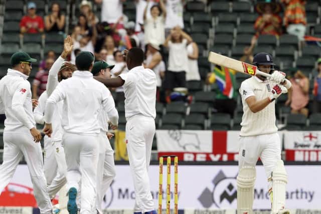 Englands  Joe Root, right, signals a review request after his dismissal by South Africas bowler Kagiso Rabada on the third morning in Johannesburg. Picture: AP/Themba Hadebe.