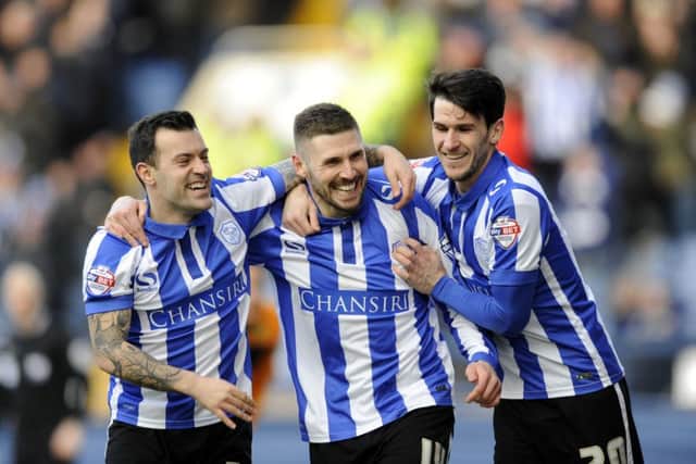 Owls two goal hero Gary Hooper celebrates with Ross Wallace and Kieran Lee