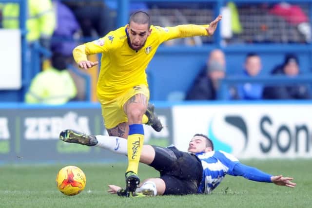 Leeds United' Giuseppe Bellusci is challenged by Daniel Pudil.