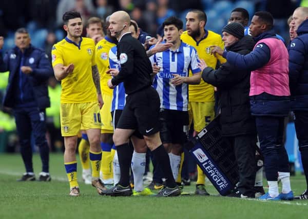 Referee Anthony Taylor is surrounded by Leeds players after the disallowed goal. (Picture: Simon Hulme)