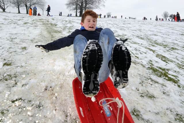 Children enjoy the snow at Roundhay Park, Leeds.Joe Parkin takes to the air on the slopes.17th January 2016 ..Picture by Simon Hulme