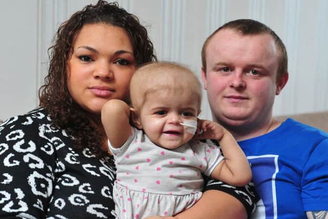 Amie Mills and Damion Sutcliffe picture with Skye last year. Picture Tony Johnson.