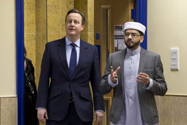David Cameron with Imam Qari Asim during a visit to the  Makkah Masjid Mosque in Leeds