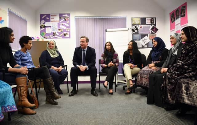 David Cameron meets women attending an English language class during a visit to the Shantona Women's Centre in Leeds