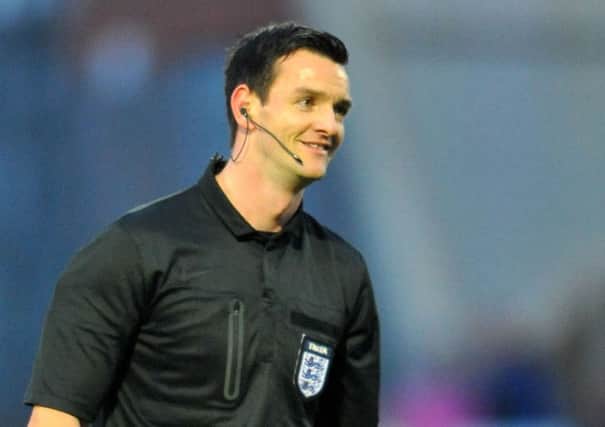 West Yorkshire-based referee Andy Madley.