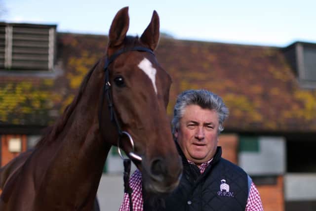 Trainer Paul Nicholls with Silviniaco Conti at Manor Farm Stables in Somerset.