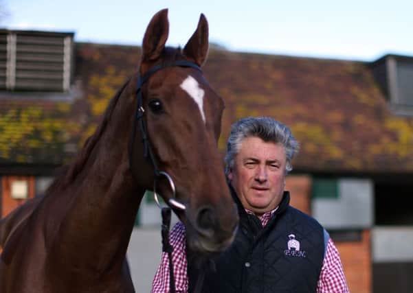 Trainer Paul Nicholls with Silviniaco Conti at Manor Farm Stables in Somerset.