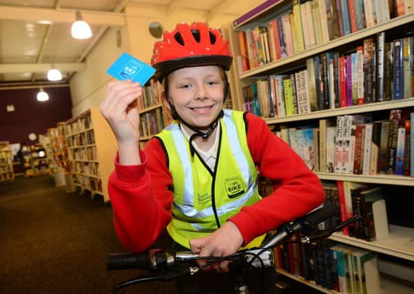 Allerton C of E Primary School pupil Bobbie Glew at the launch of a new bike library at Moor Allerton Library in Leeds.