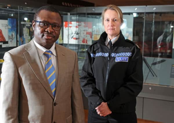 Vincent Uzomah who was stabbed by a teenage boy, with West Yorkshire Police Temporary Assistant Chief Constable Angela Williams